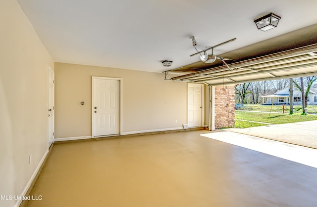 garage featuring baseboards and a garage door opener