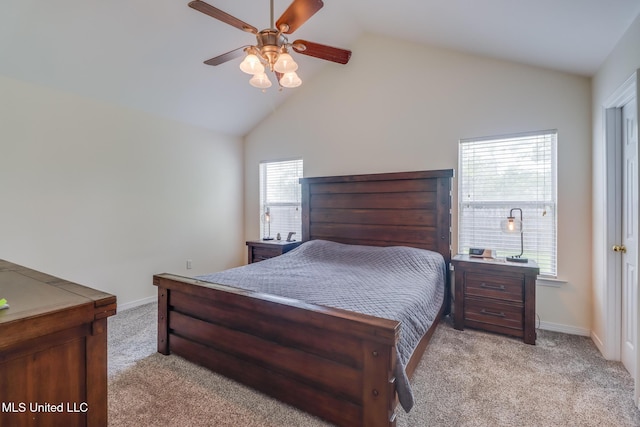 bedroom featuring baseboards, light colored carpet, ceiling fan, and vaulted ceiling