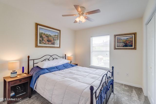 carpeted bedroom featuring baseboards, ceiling fan, and a closet