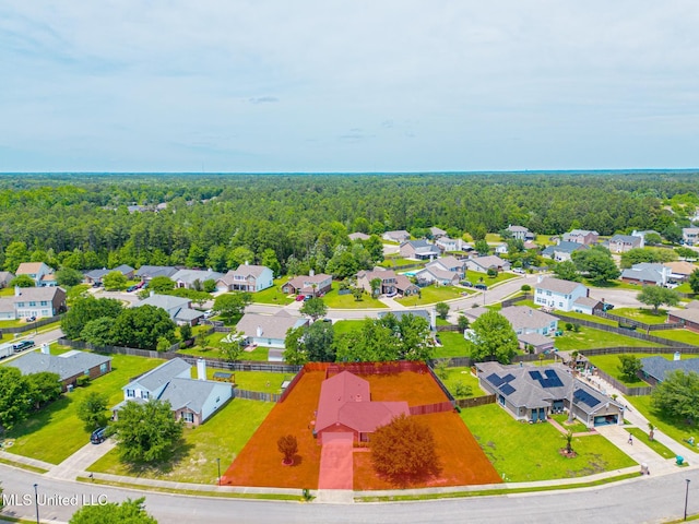 drone / aerial view with a view of trees and a residential view