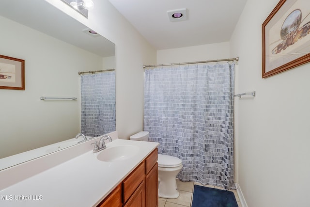 full bathroom with vanity, tile patterned flooring, and toilet