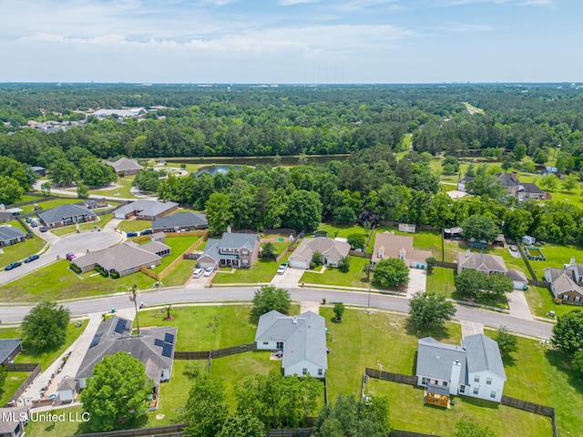 birds eye view of property with a residential view and a forest view