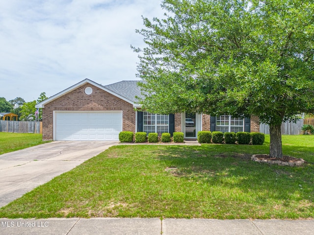 view of front of property with brick siding, fence, a front yard, and a garage