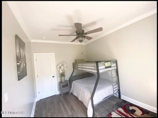 bedroom with crown molding, dark wood-type flooring, and ceiling fan