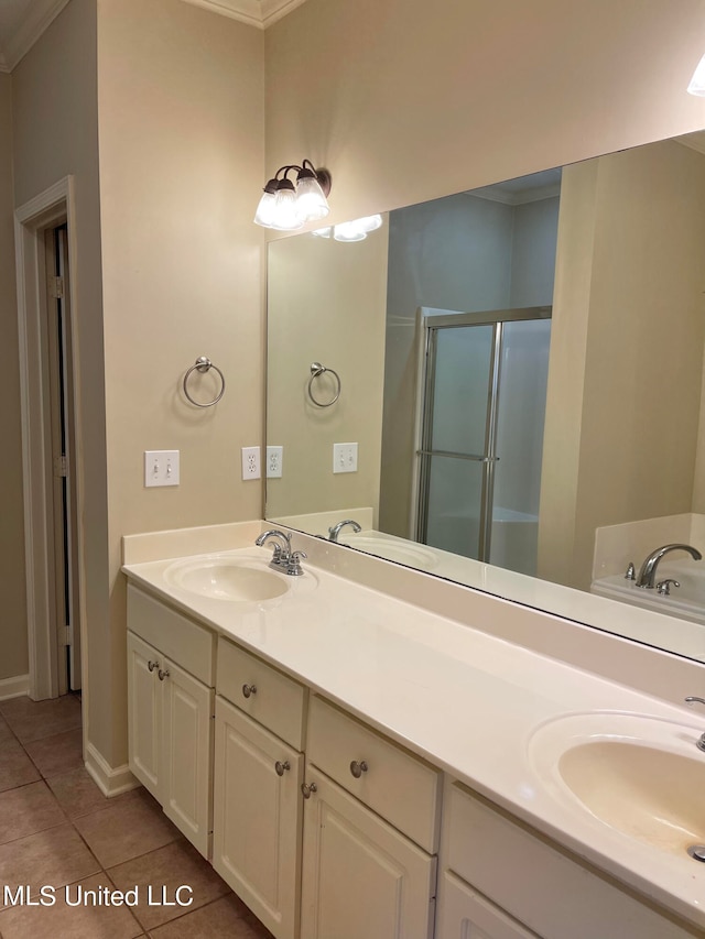 bathroom with vanity, an enclosed shower, ornamental molding, and tile patterned flooring