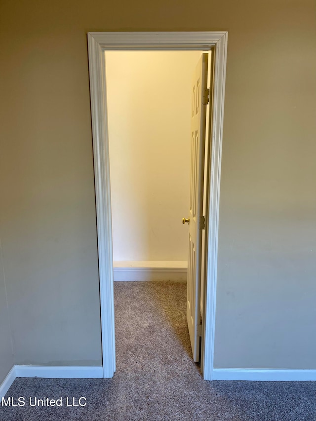 hallway featuring light carpet