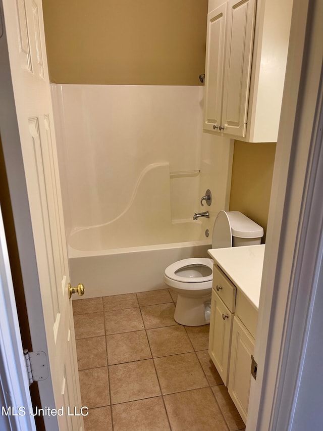 full bathroom featuring vanity, shower / tub combination, toilet, and tile patterned flooring