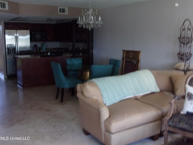 living room featuring a notable chandelier