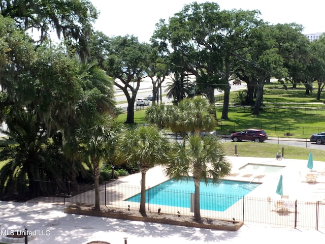 view of swimming pool with a patio area