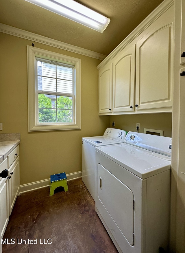 109 Brisage Dr, Madison, MS 39110 - clothes washing area featuring washer and dryer, baseboards, crown molding, and cabinet space