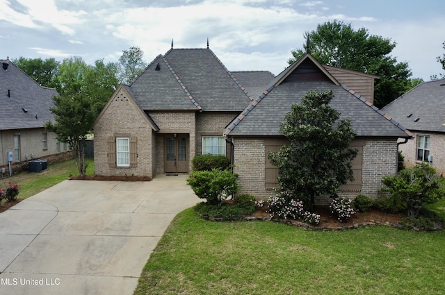109 Brisage Dr, Madison, MS 39110 - french provincial home with brick siding, central air condition unit, and a front lawn