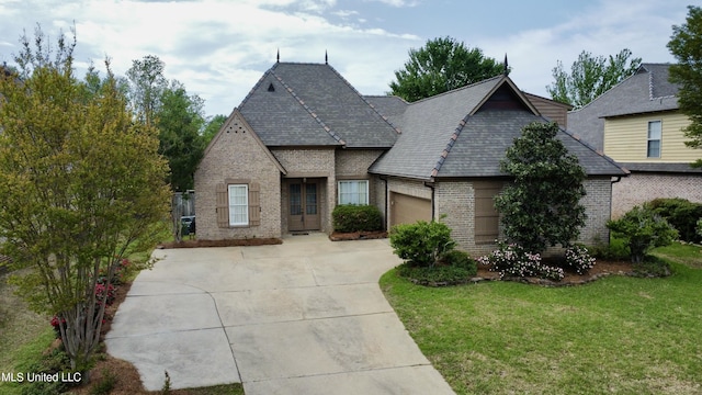 109 Brisage Dr, Madison, MS 39110 - view of front of home featuring a garage, concrete driveway, a front lawn, and brick siding