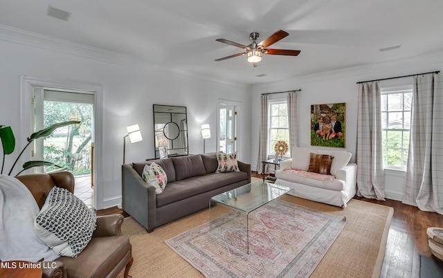 living room featuring crown molding, ceiling fan, and hardwood / wood-style flooring