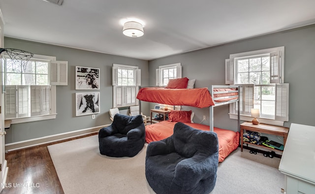 bedroom with dark wood-type flooring