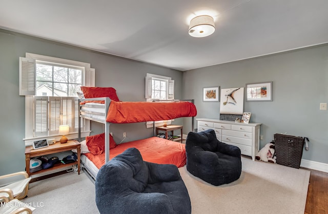 bedroom with hardwood / wood-style floors