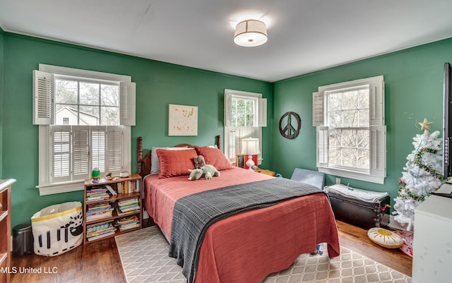 bedroom featuring wood-type flooring