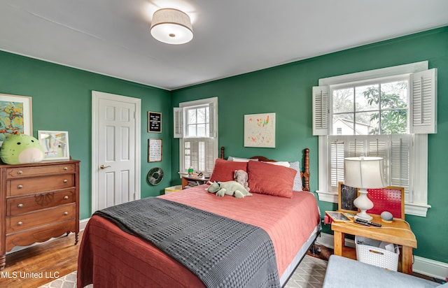 bedroom with wood-type flooring