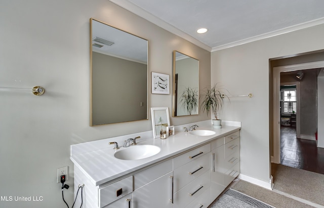 bathroom featuring ornamental molding and vanity