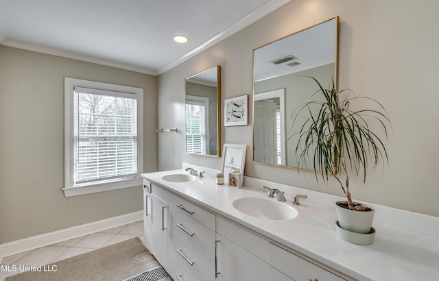 bathroom featuring tile patterned floors, ornamental molding, and vanity