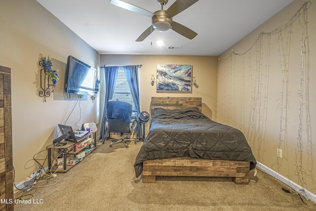 bedroom with ceiling fan and carpet floors