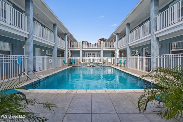 view of pool featuring a patio