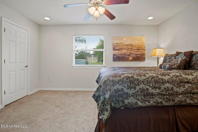 carpeted bedroom with ceiling fan