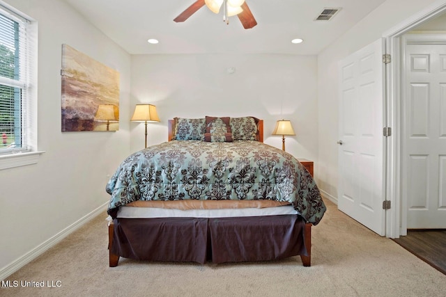 carpeted bedroom with ceiling fan