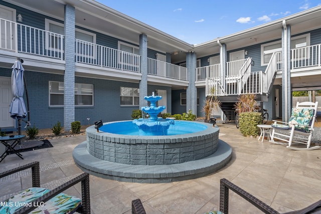 view of community with a patio area