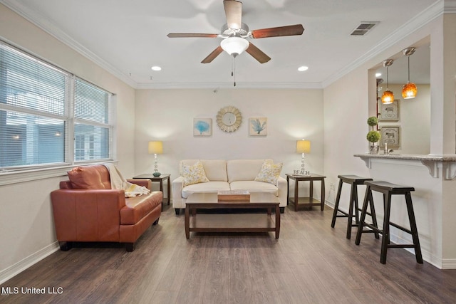 living room featuring crown molding, dark hardwood / wood-style floors, and ceiling fan