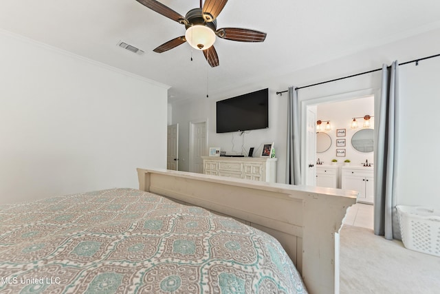 bedroom featuring a ceiling fan, crown molding, connected bathroom, light carpet, and visible vents