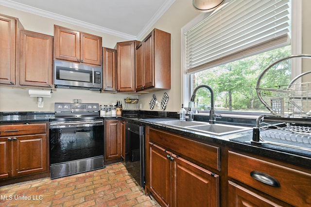 kitchen featuring a sink, appliances with stainless steel finishes, brown cabinets, brick floor, and ornamental molding