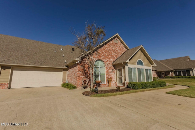 view of front of house with a front lawn and a garage