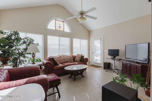 tiled living room with high vaulted ceiling and ceiling fan