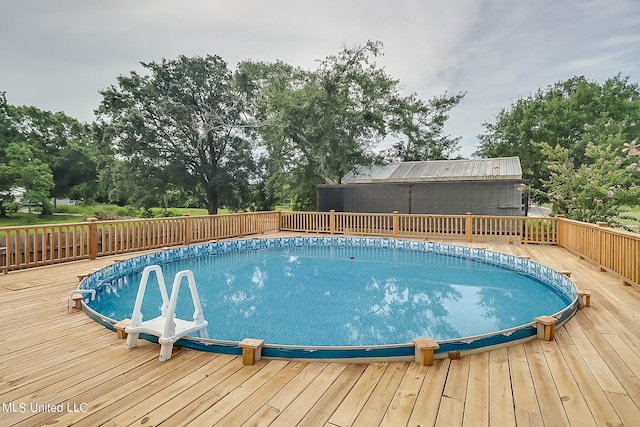 view of pool featuring a wooden deck