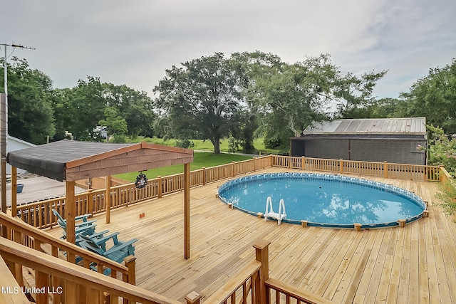 view of swimming pool featuring a wooden deck