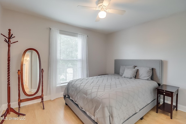 bedroom featuring light wood-type flooring and ceiling fan