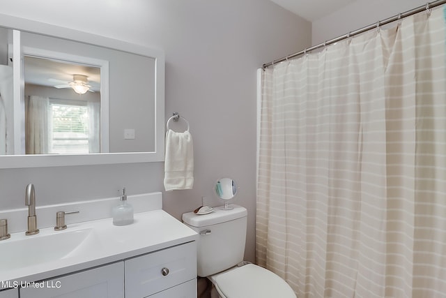 bathroom with ceiling fan, vanity, and toilet