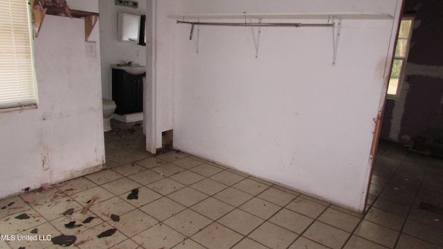 3001 Hewes Ave, Gulfport, MS 39507 - interior space with light tile patterned flooring and a sink