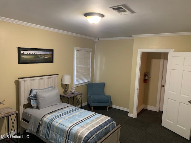 bedroom featuring crown molding, visible vents, dark carpet, and baseboards