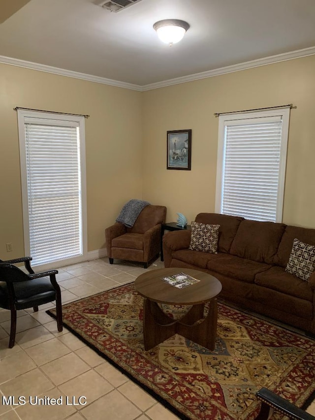 living area featuring light tile patterned floors and ornamental molding