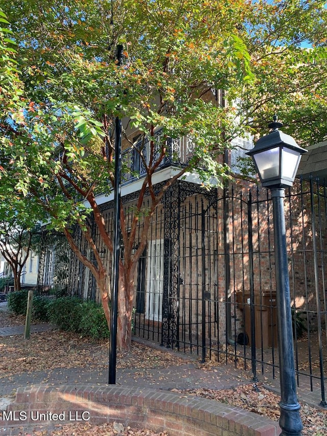 view of gate with a fenced front yard