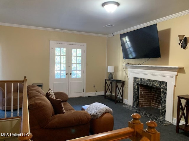 living room featuring a fireplace, carpet, baseboards, ornamental molding, and french doors