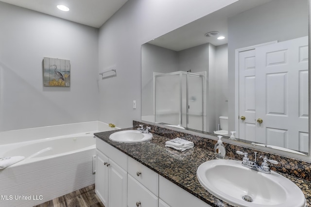 2252 Beach Dr Unit 602, Gulfport, MS 39507 - full bathroom featuring a shower stall, double vanity, a garden tub, and wood finished floors