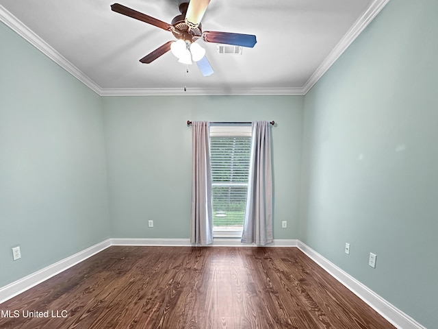 spare room featuring a ceiling fan, baseboards, dark wood-type flooring, and ornamental molding
