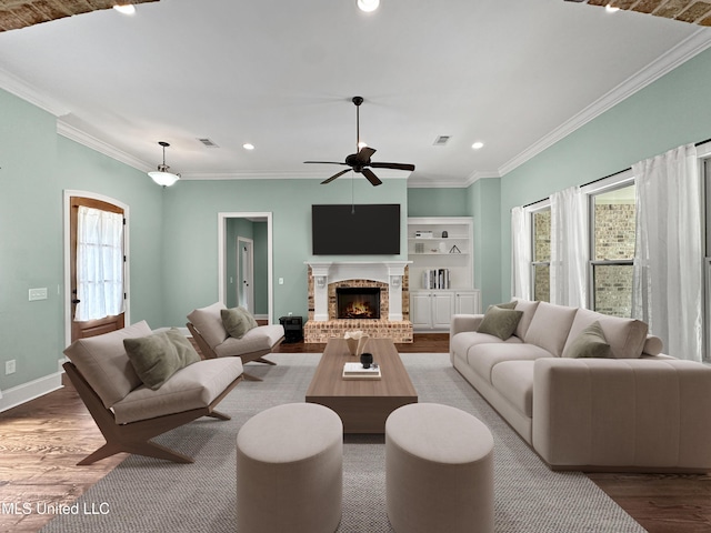 103 Saint Charles Ave, Florence, MS 39073 - living room featuring plenty of natural light, wood finished floors, ceiling fan, ornamental molding, and recessed lighting
