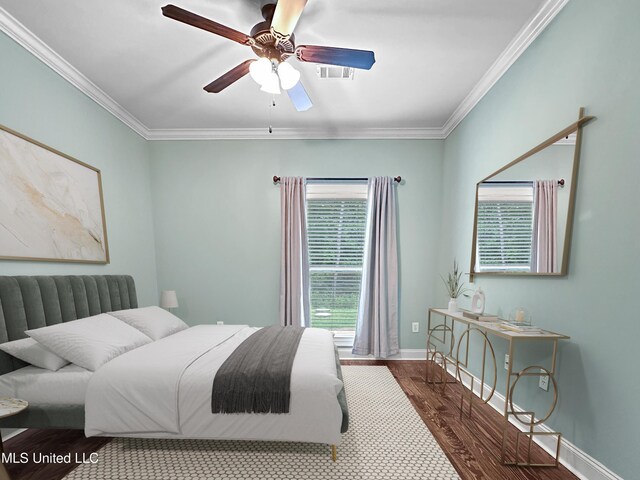 103 Saint Charles Ave, Florence, MS 39073 - bedroom featuring wood finished floors, crown molding, ceiling fan, and baseboards