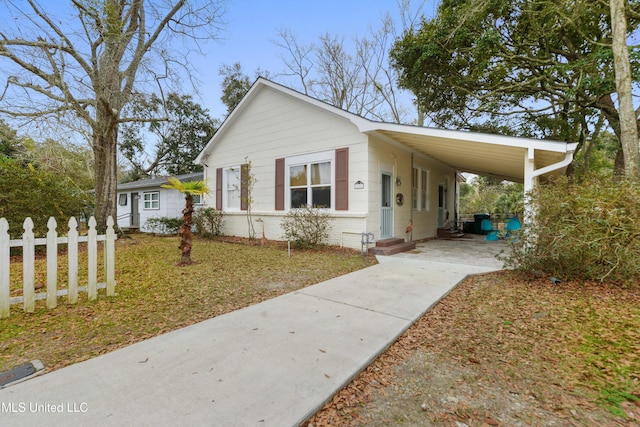 view of front of home featuring a carport