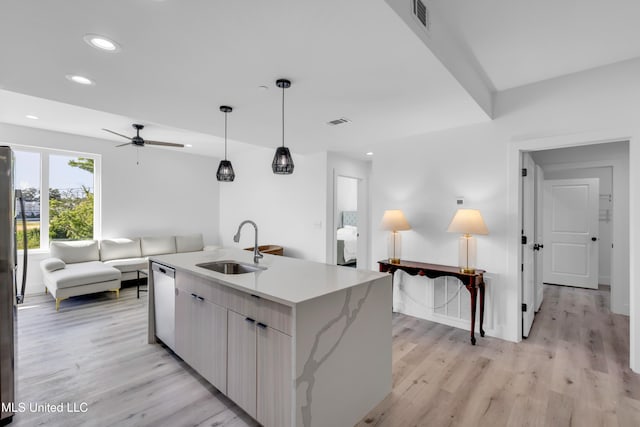 1302 Magnolia St Unit A101, Gulfport, MS 39507 - kitchen featuring appliances with stainless steel finishes, recessed lighting, open floor plan, light wood-type flooring, and ceiling fan