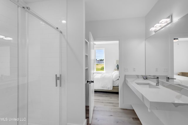 1302 Magnolia St Unit A101, Gulfport, MS 39507 - ensuite bathroom with vanity, wood finished floors, and a shower stall