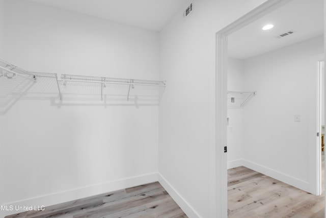 1302 Magnolia St Unit A101, Gulfport, MS 39507 - walk in closet with light wood-style floors